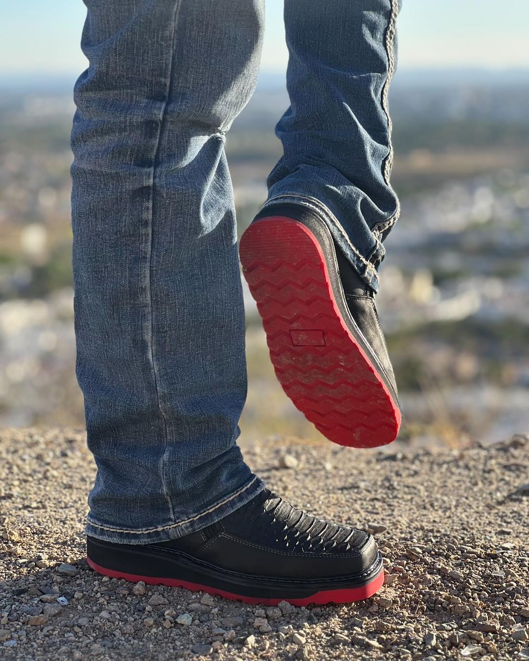Python patterned red soled black boots